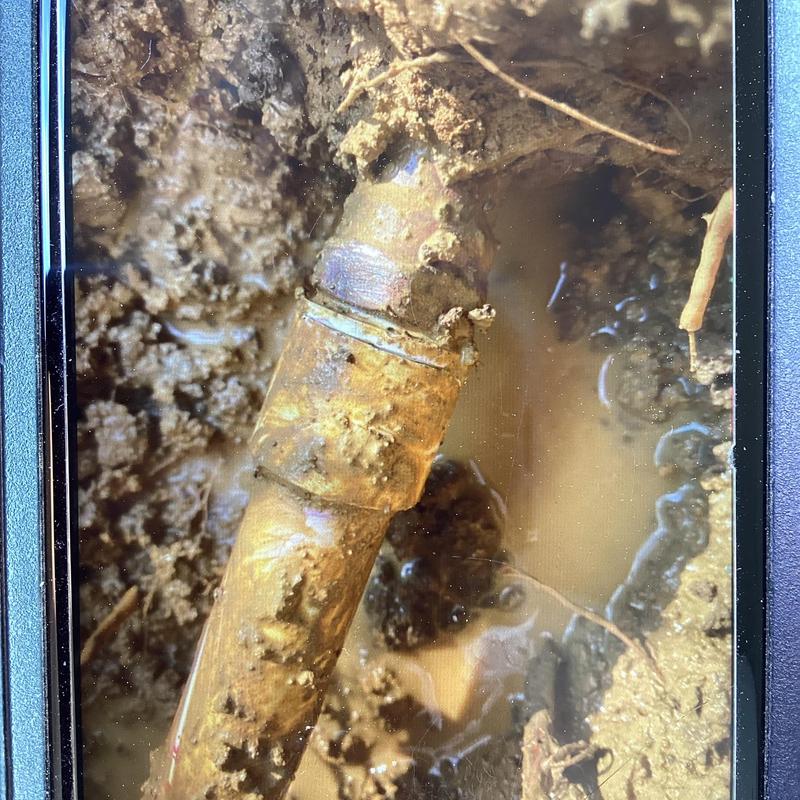 34 PVC water pipe with muddy leak repair site