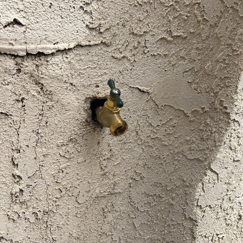 Hose bib replacement with patched stucco wall