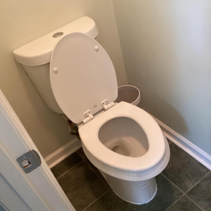 Toilet with new wax ring on slab floor