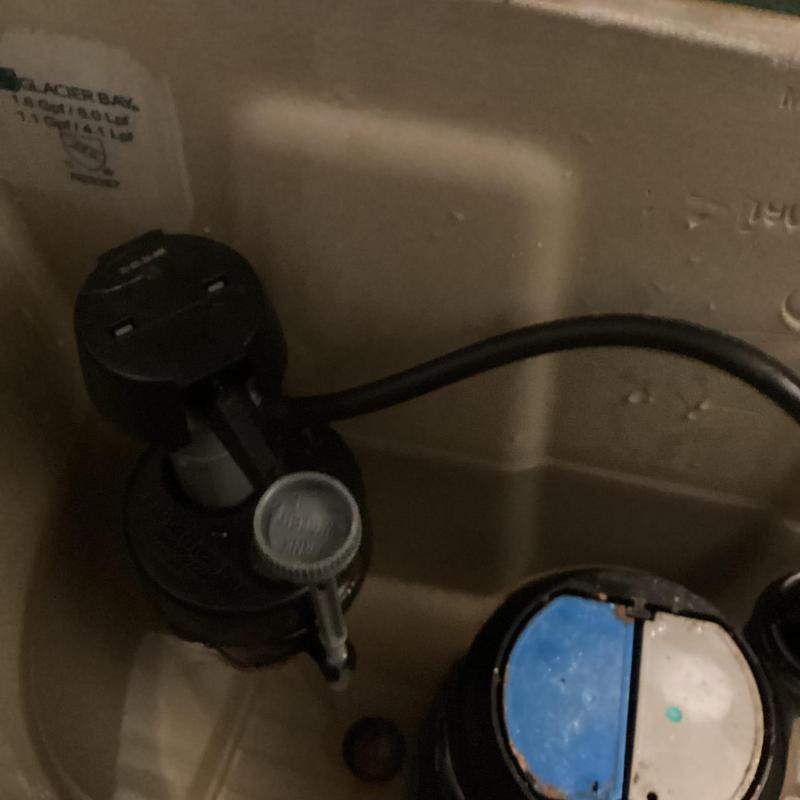 Toilet fill valve inside tank with overflow tube