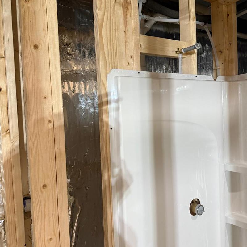 Shower plumbing rough-in with framing in basement