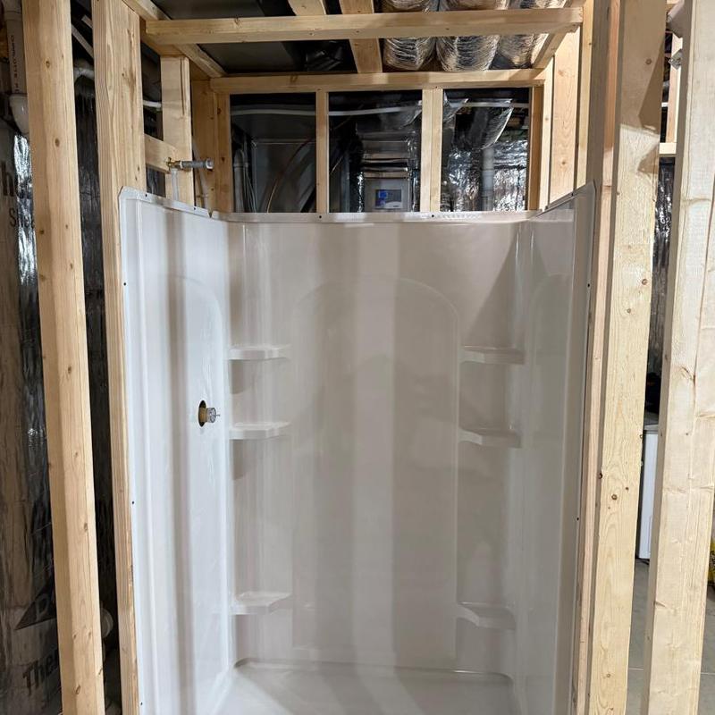 Shower stall rough-in plumbing in basement framing