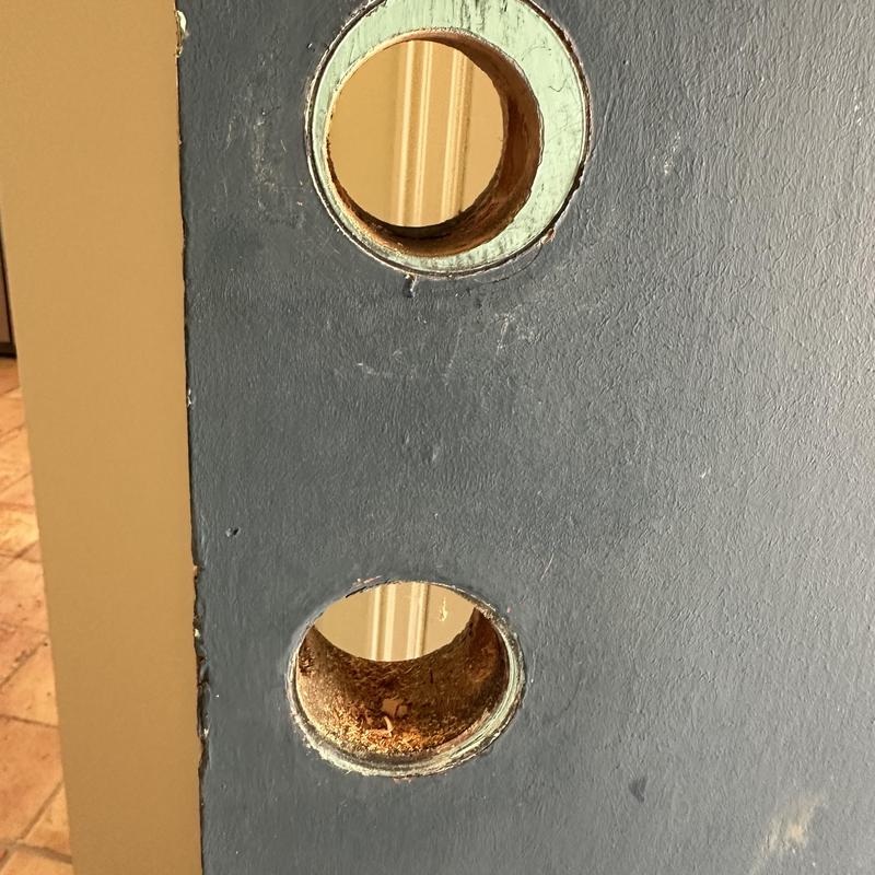 Door lock holes drilled before installation and wrapping