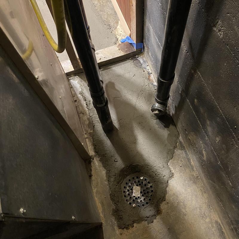 Main sewer line trenchless replacement with new drain cover Main sewer line trenchless replacement with new drain cover