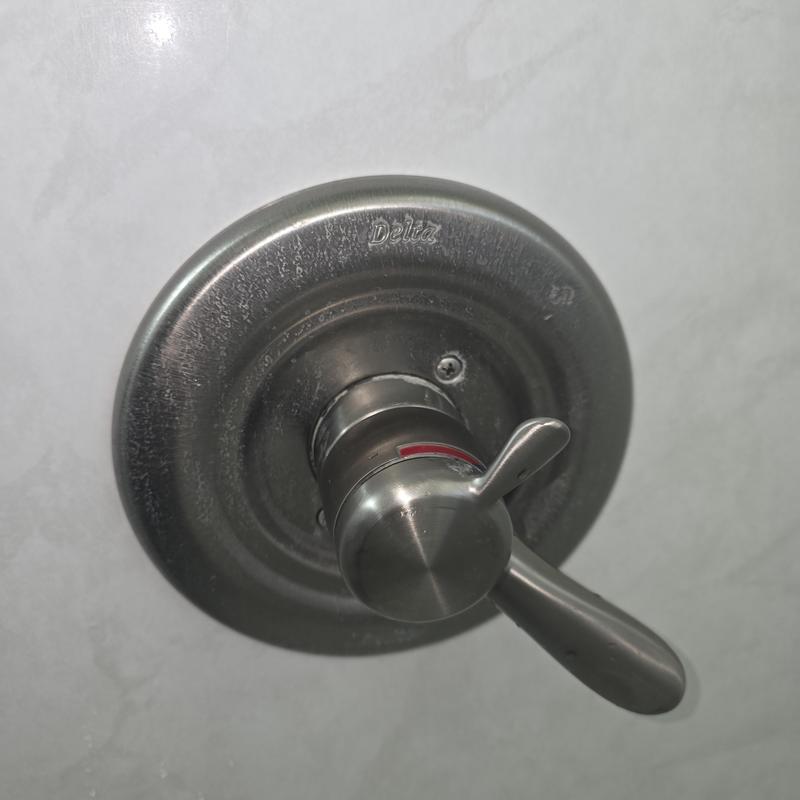 Delta shower thermostatic control valve handle close-up