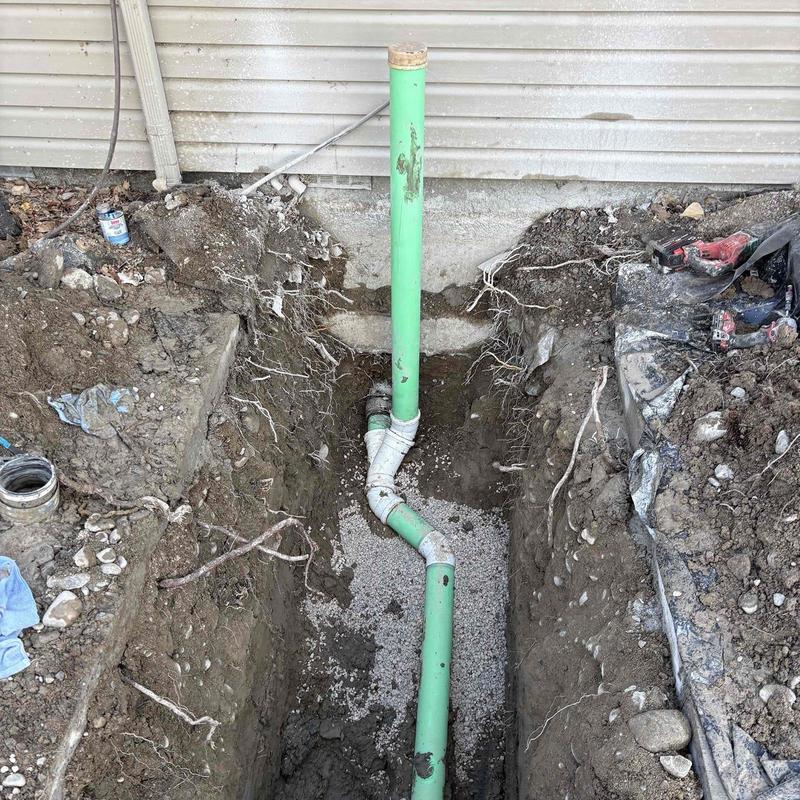 Sewer cleanout pipe installed in excavation trench Sewer cleanout pipe installed in excavation trench