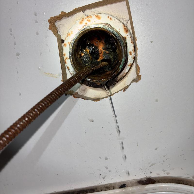 Sink drain clog removal with plumbing cable and leak test