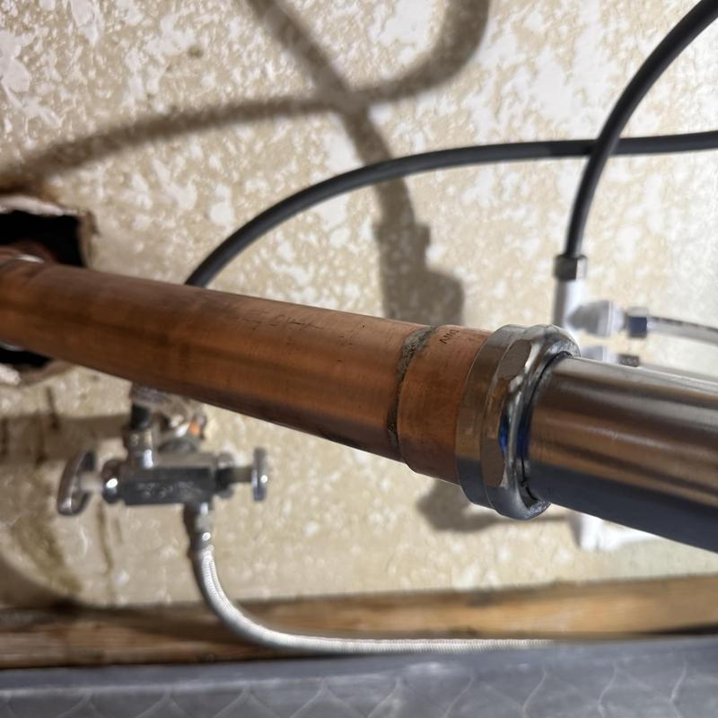 Copper water supply pipe with compression fitting installation