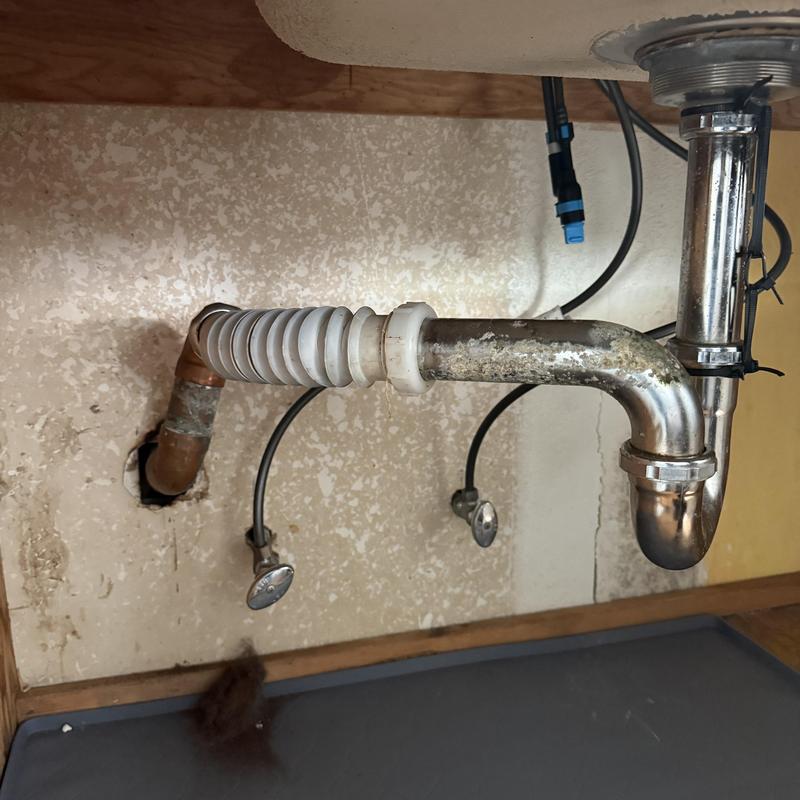 Dishwasher drain line and P-trap installation under sink