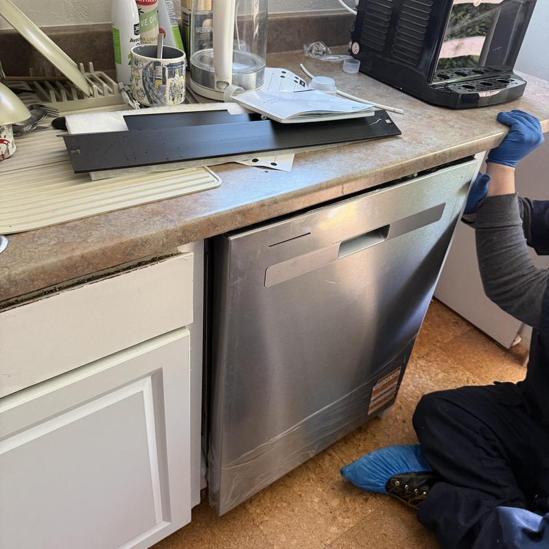 Dishwasher installation with plumbing upgrades in kitchen