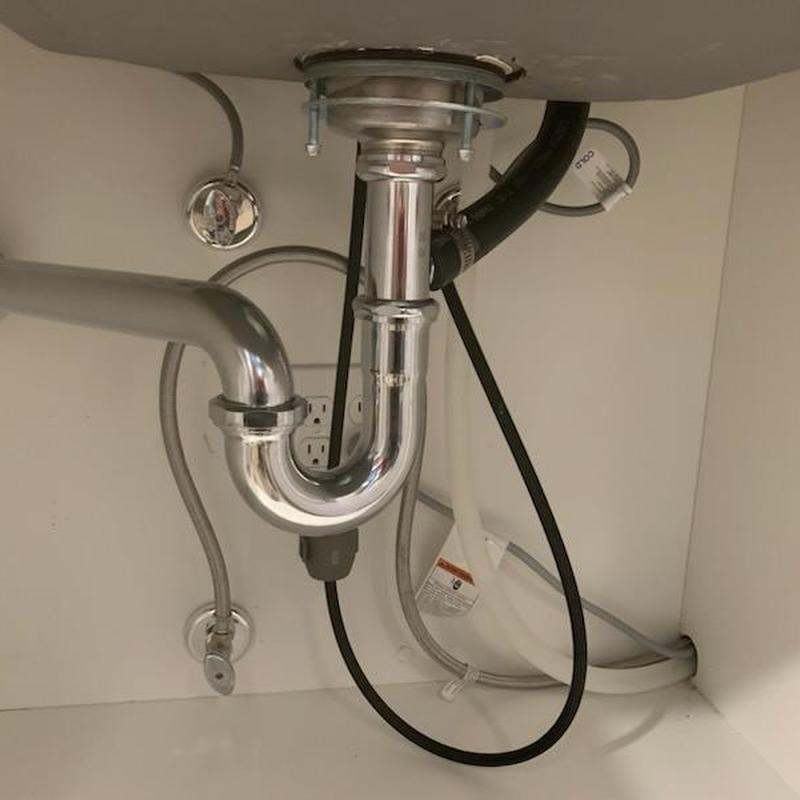 Kitchen sink drain pipe and supply lines installed