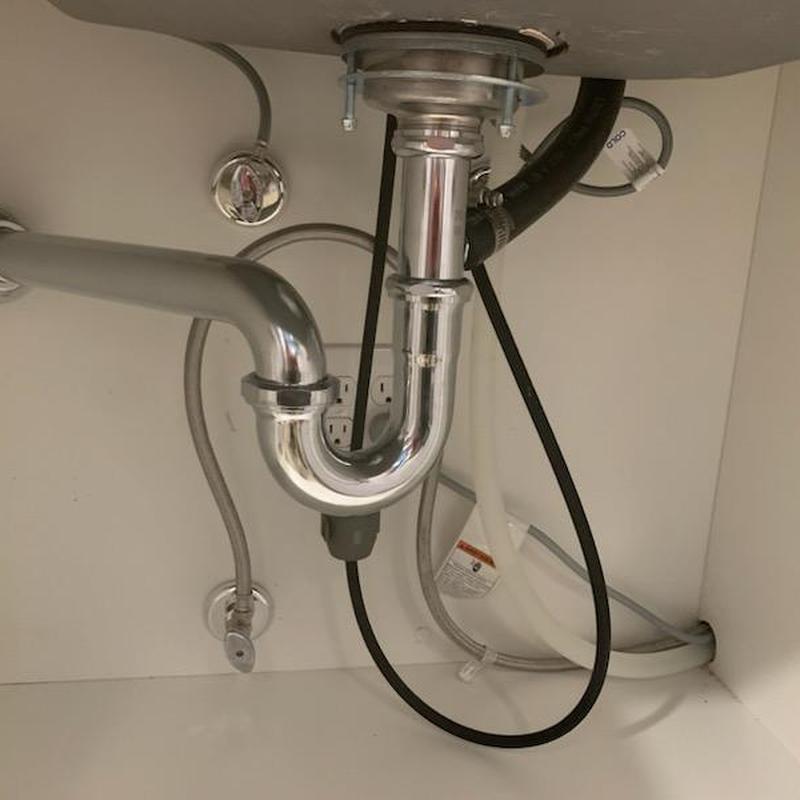 Kitchen sink basket strainer and plumbing installation