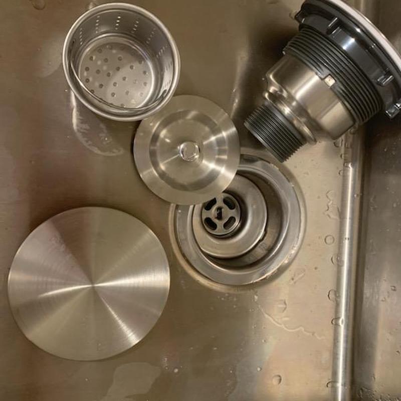 Kitchen sink basket strainer and drain parts in stainless steel sink