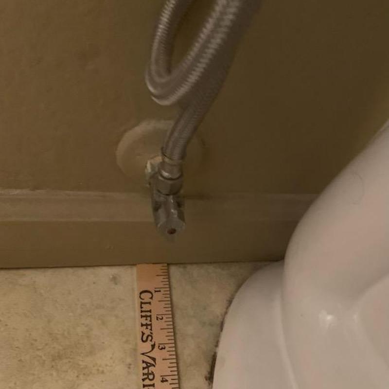 Toilet supply line connection with ruler measurement