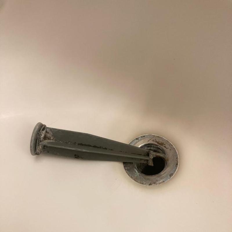 Bathtub drain lever removed with visible corrosion Bathtub drain lever removed with visible corrosion