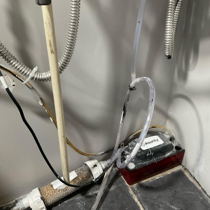 Condensate pump with reworked drain lines and tubing