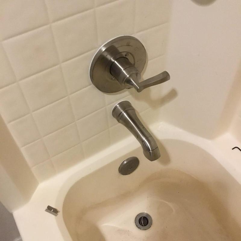 Shower faucet cartridge and trim installation in bathtub