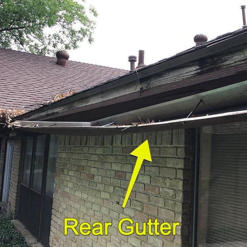 Rear gutter with debris and damaged fascia board