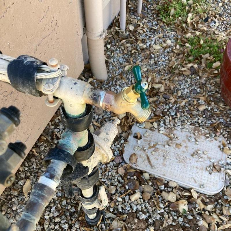 Hose bib installation on main water line outdoors