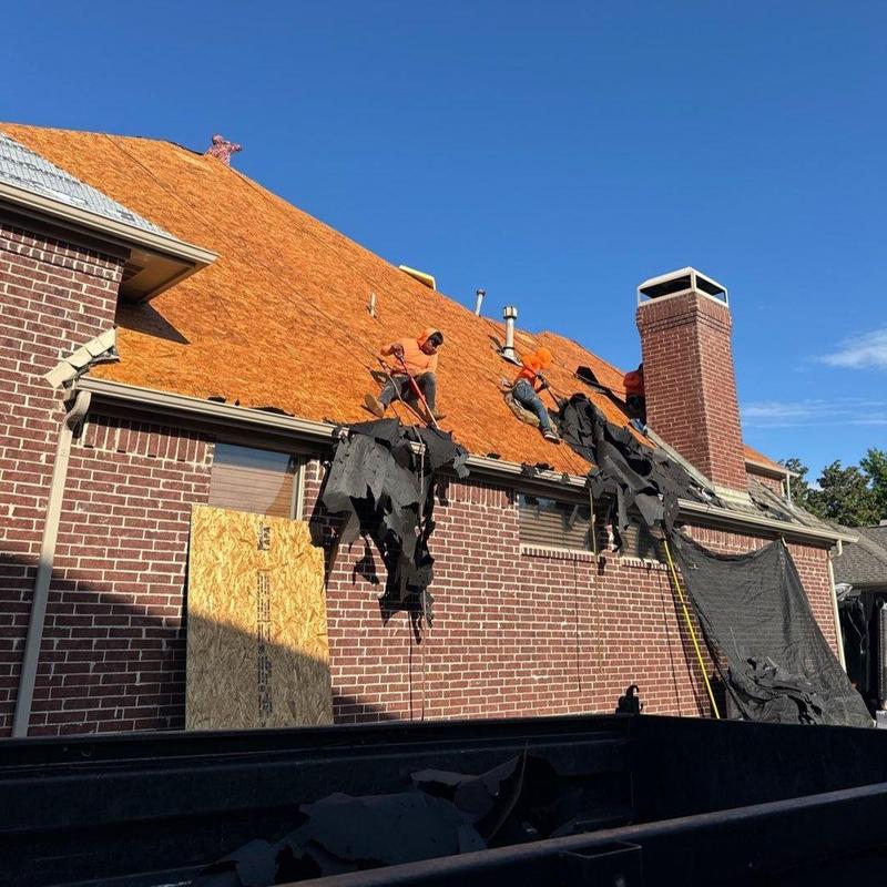 Roof decking removal on large brick home