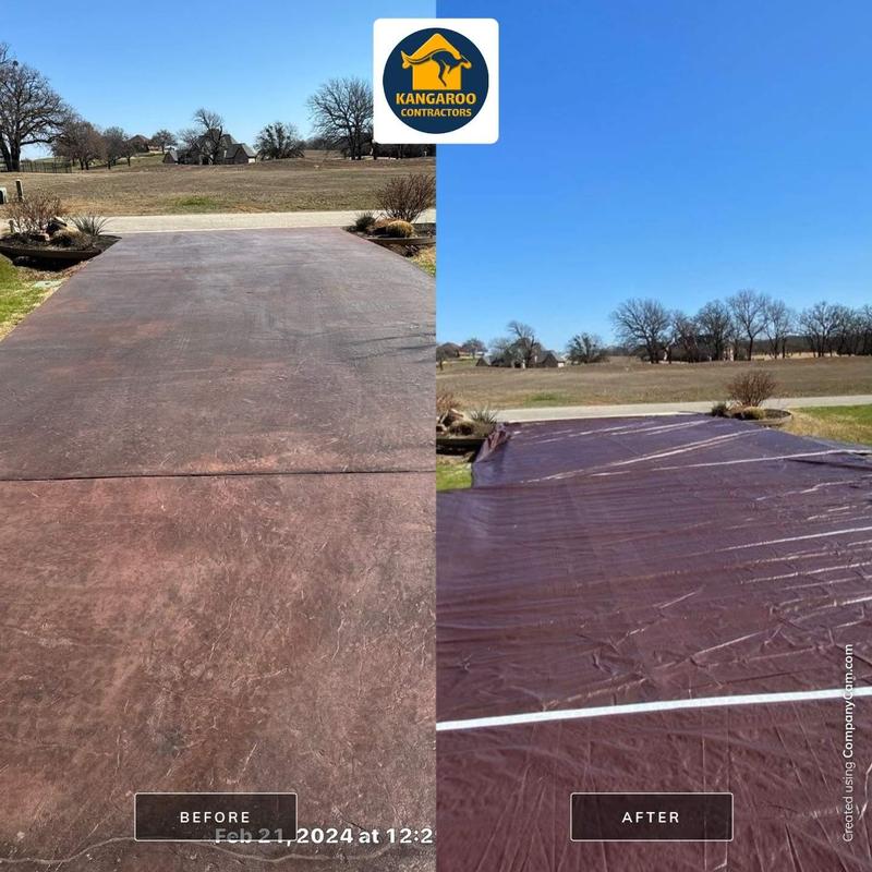 Stained driveway with protective tarp installed