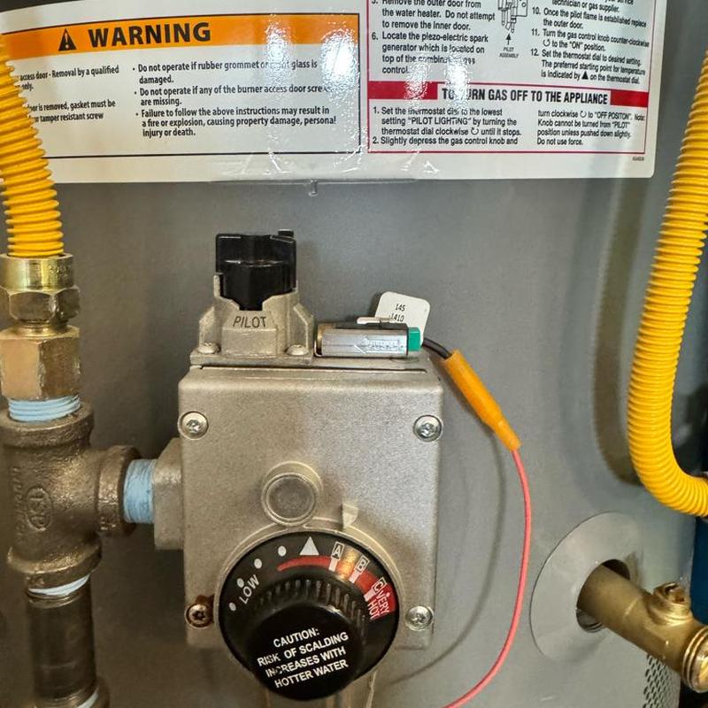 Water heater gas valve and pilot control close-up