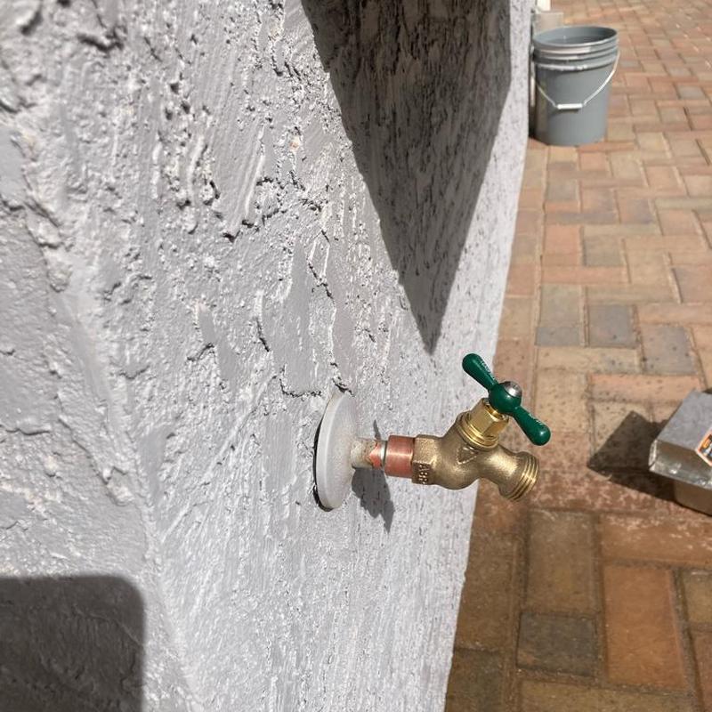 Hose bib installation on exterior wall in Mesa, AZ