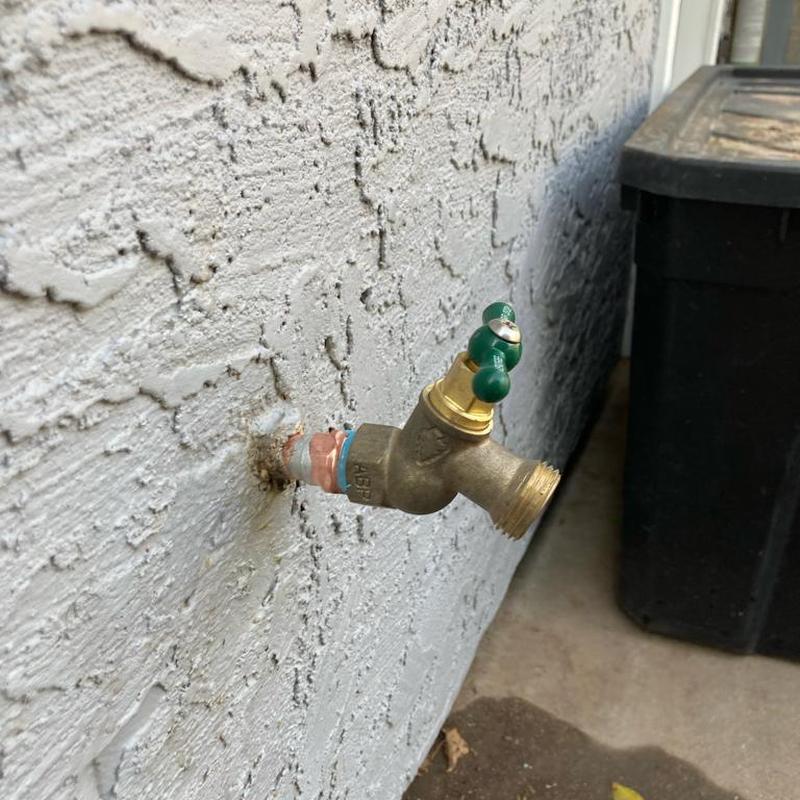 Hose bib installation on exterior wall in Mesa, AZ