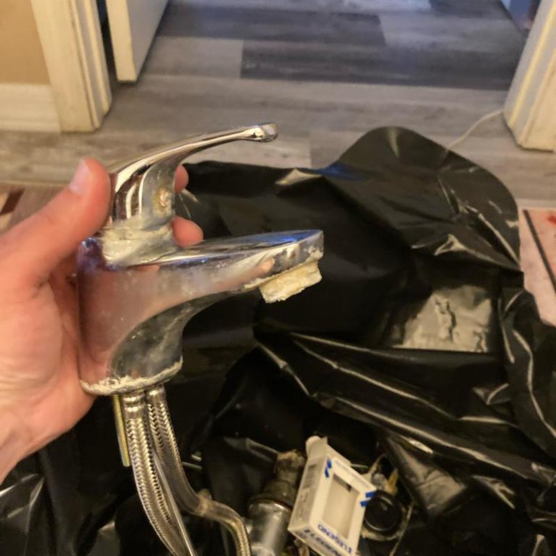 Sink faucet removal with old buildup in hand