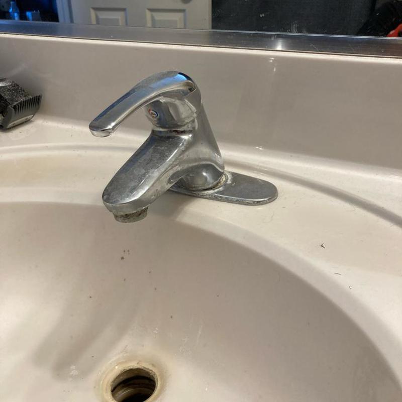 Bathroom sink faucet with worn spout and drain hole