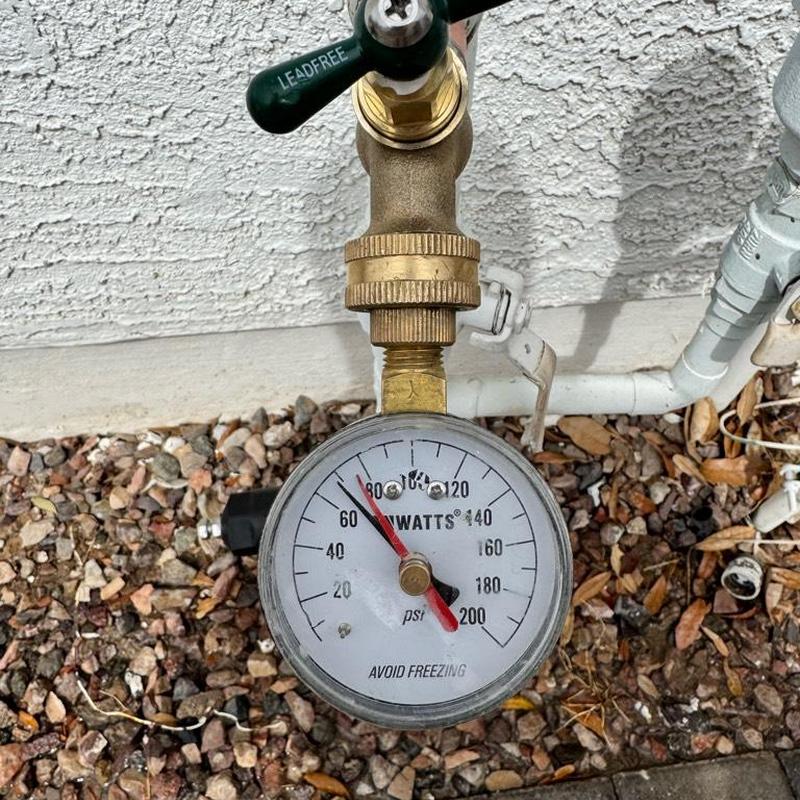 Pressure gauge on hose bib with reduced pressure