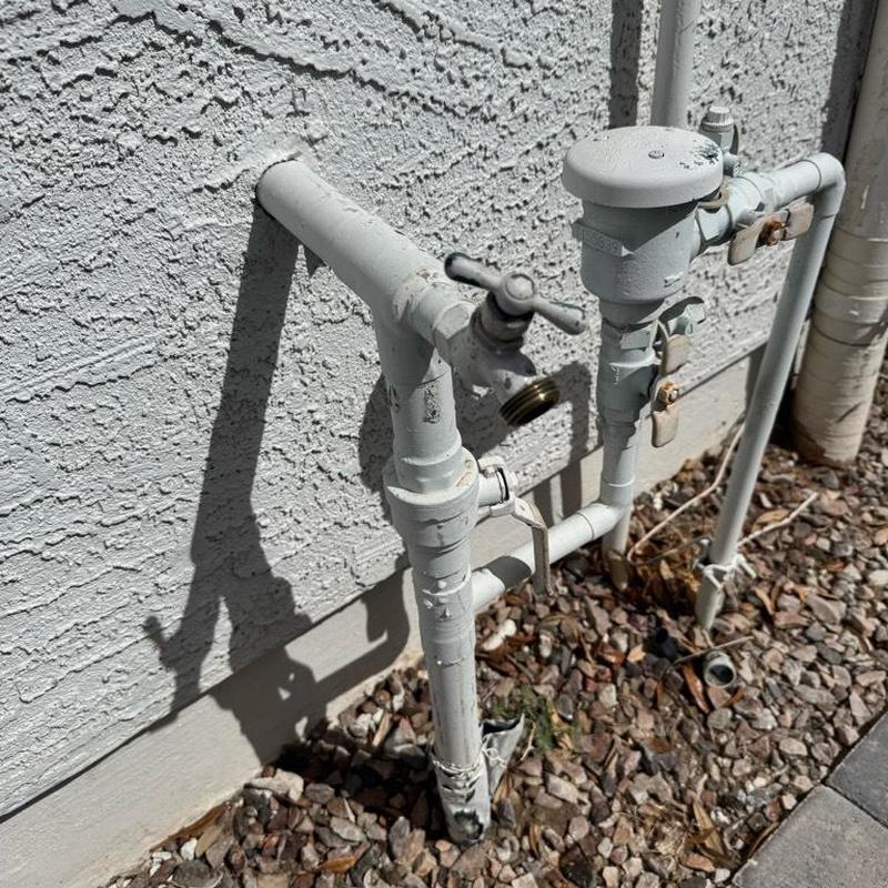 Pressure reducing valve and hose bibs on exterior pipe