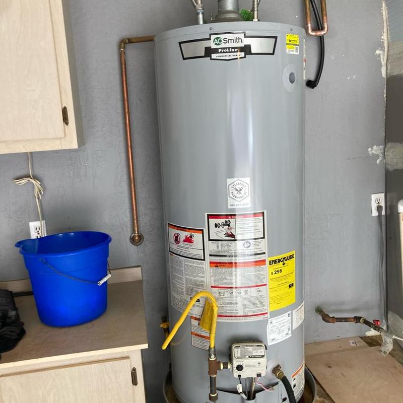 Gas water heater installation with leak pan