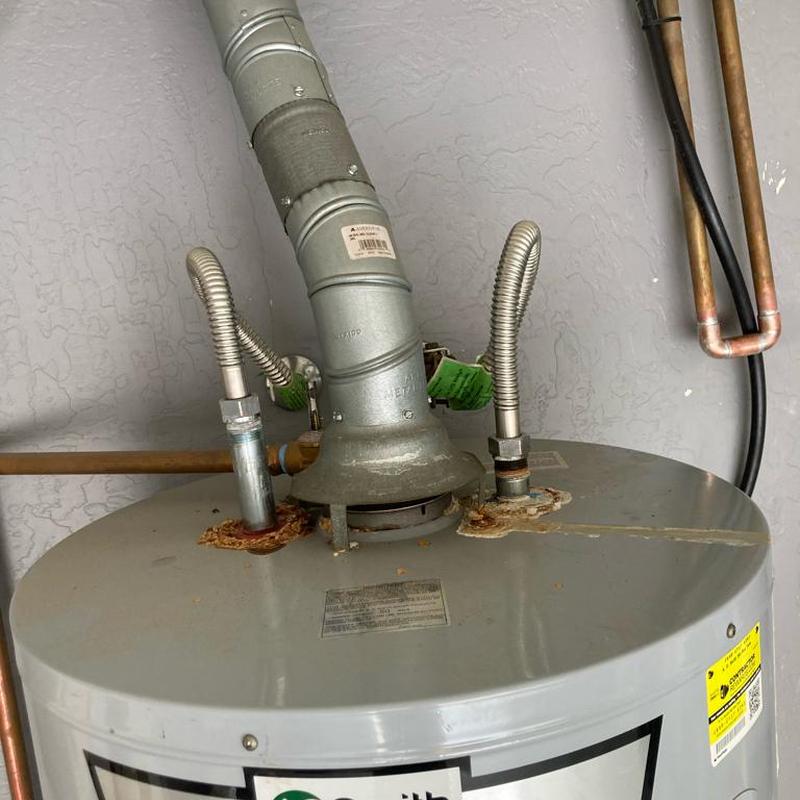 Gas water heater with vent pipe and copper piping