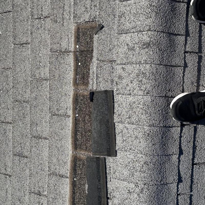 Asphalt shingles damage with missing granules on roof