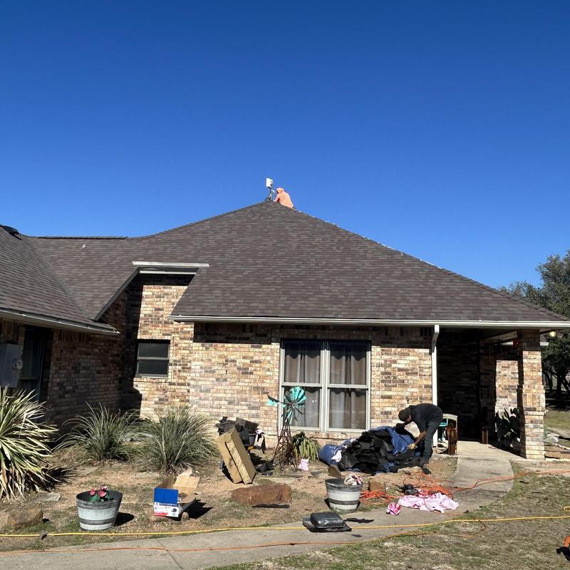Three-dimensional architectural roof shingles in teak color