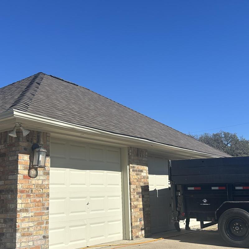 Owens Corning teak shingle roof with garage door