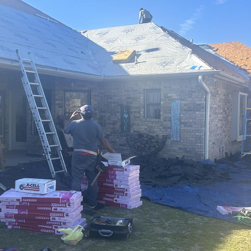 Synthetic roofing underlayment installation on residential roof