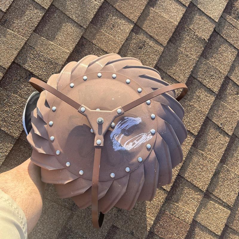 Roof turbine vent on asphalt shingle roof