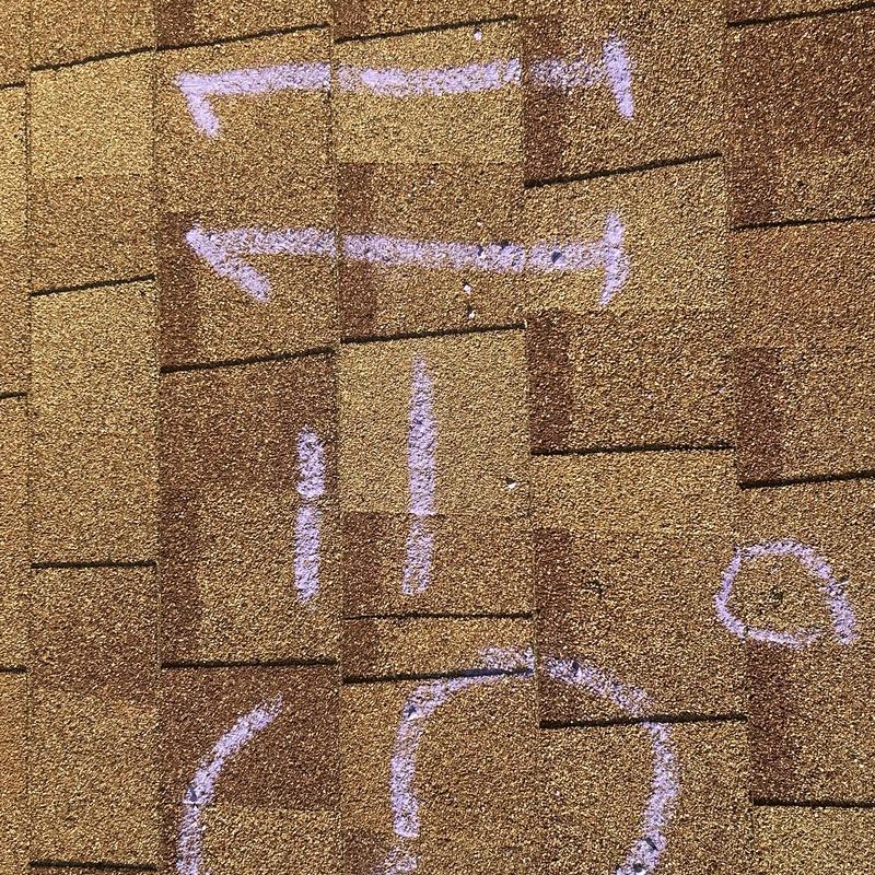 Roof shingles with chalk markings for inspection
