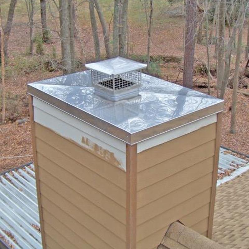 Chimney cap with metal cover and mesh vent