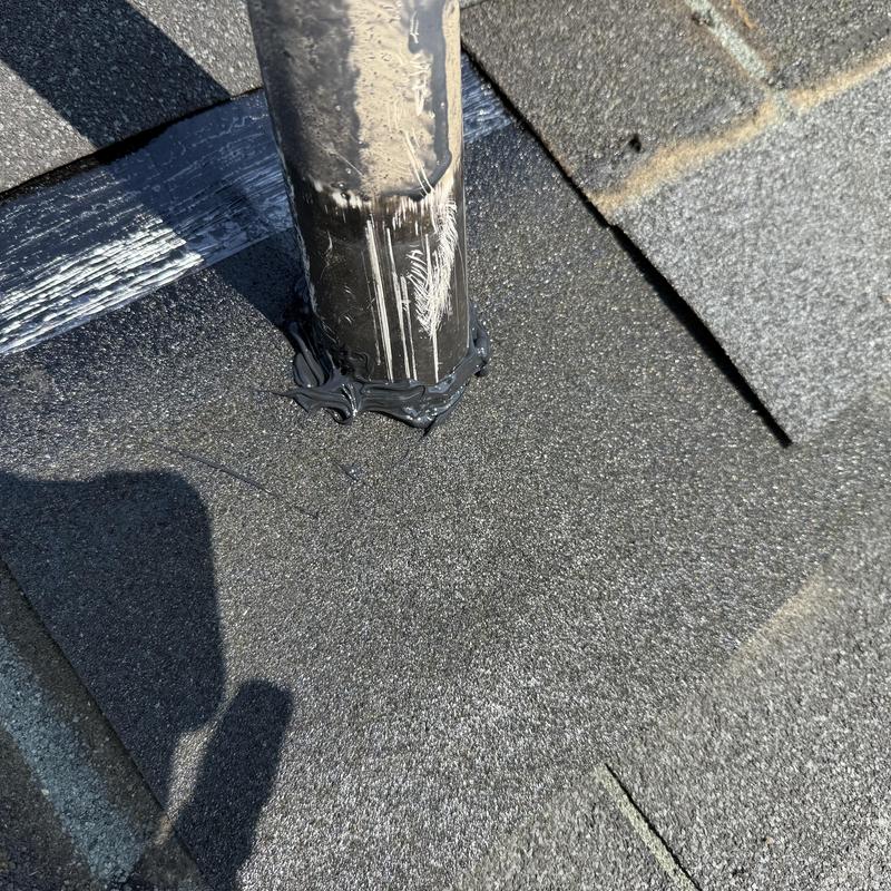 Pipe boot sealing repair on asphalt roof shingles