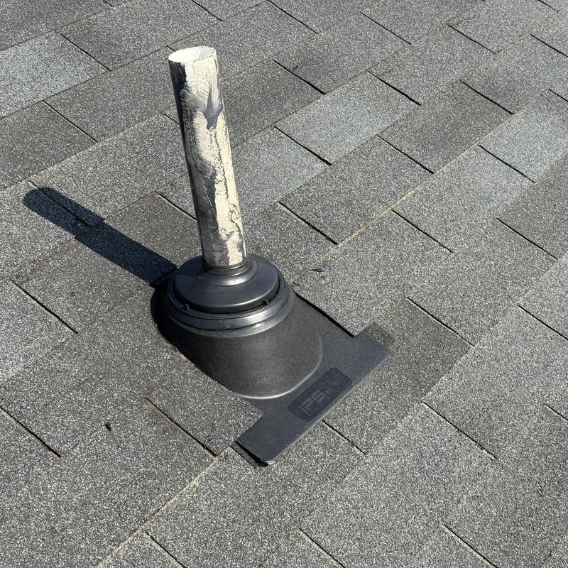 Pipe boot flashing on asphalt shingle roof