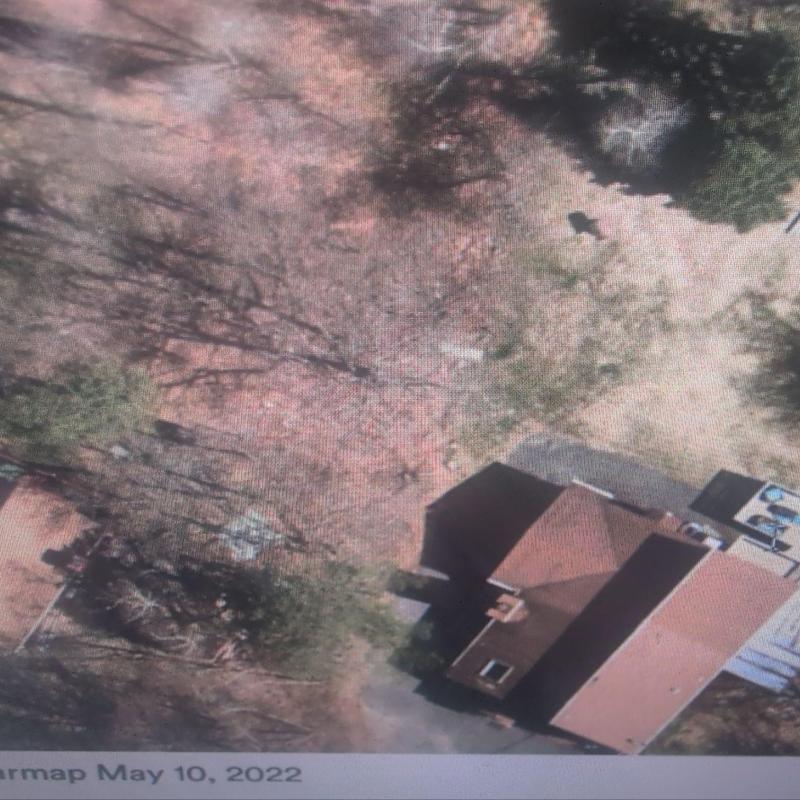 Roof shingles inspection on residential home aerial view