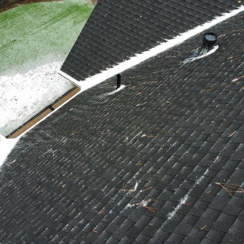 Asphalt shingle roof with snow and debris removal