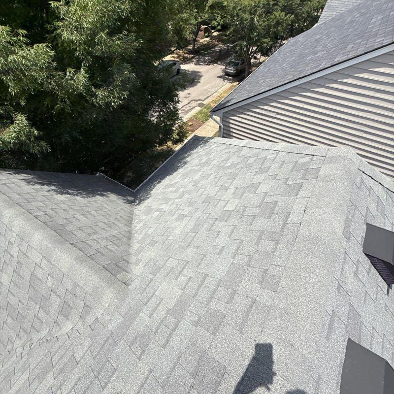 Asphalt shingle roof with hail damage inspection