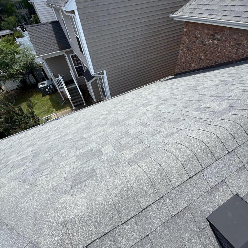 Asphalt shingle roof with hail damage and granule loss