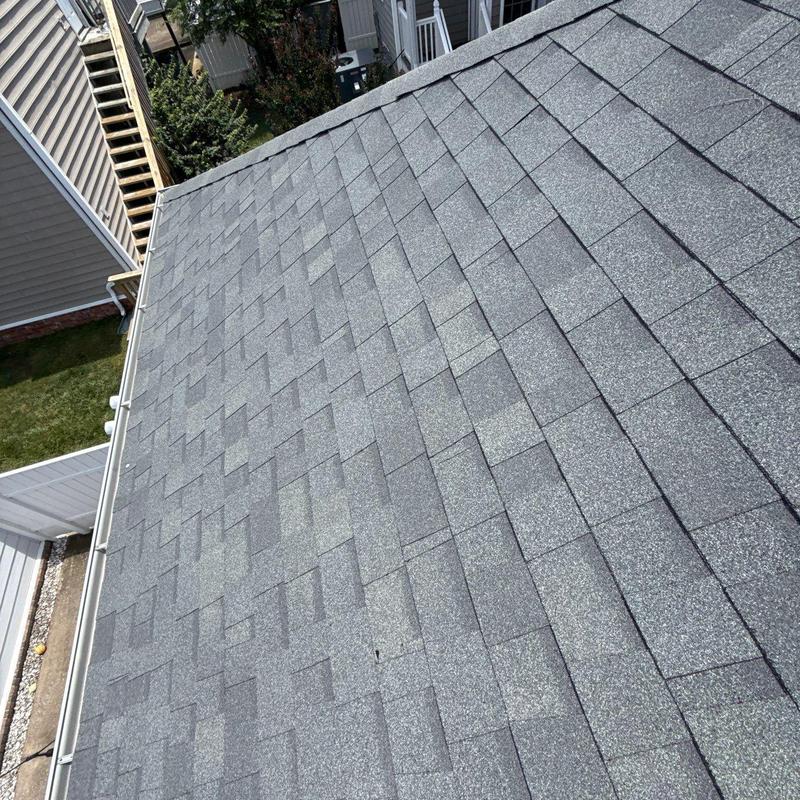 Asphalt shingle roof with hail damage and granule loss