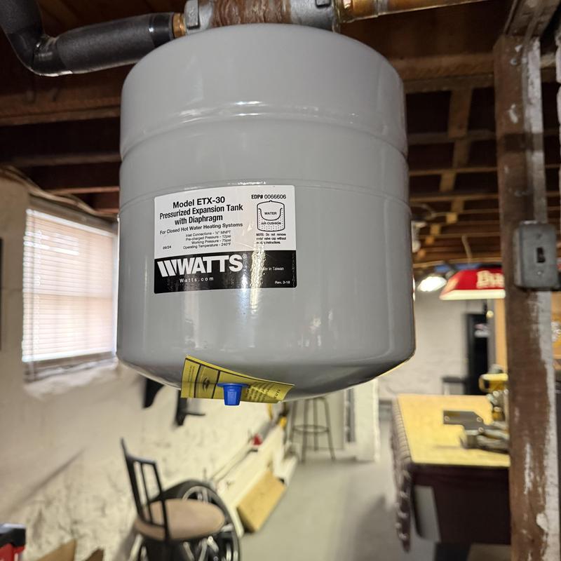 Pressurized expansion tank installed in basement boiler system