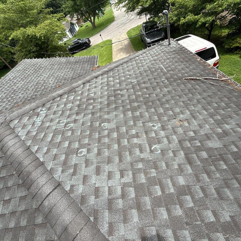 Architectural shingle roof with hail damage marks